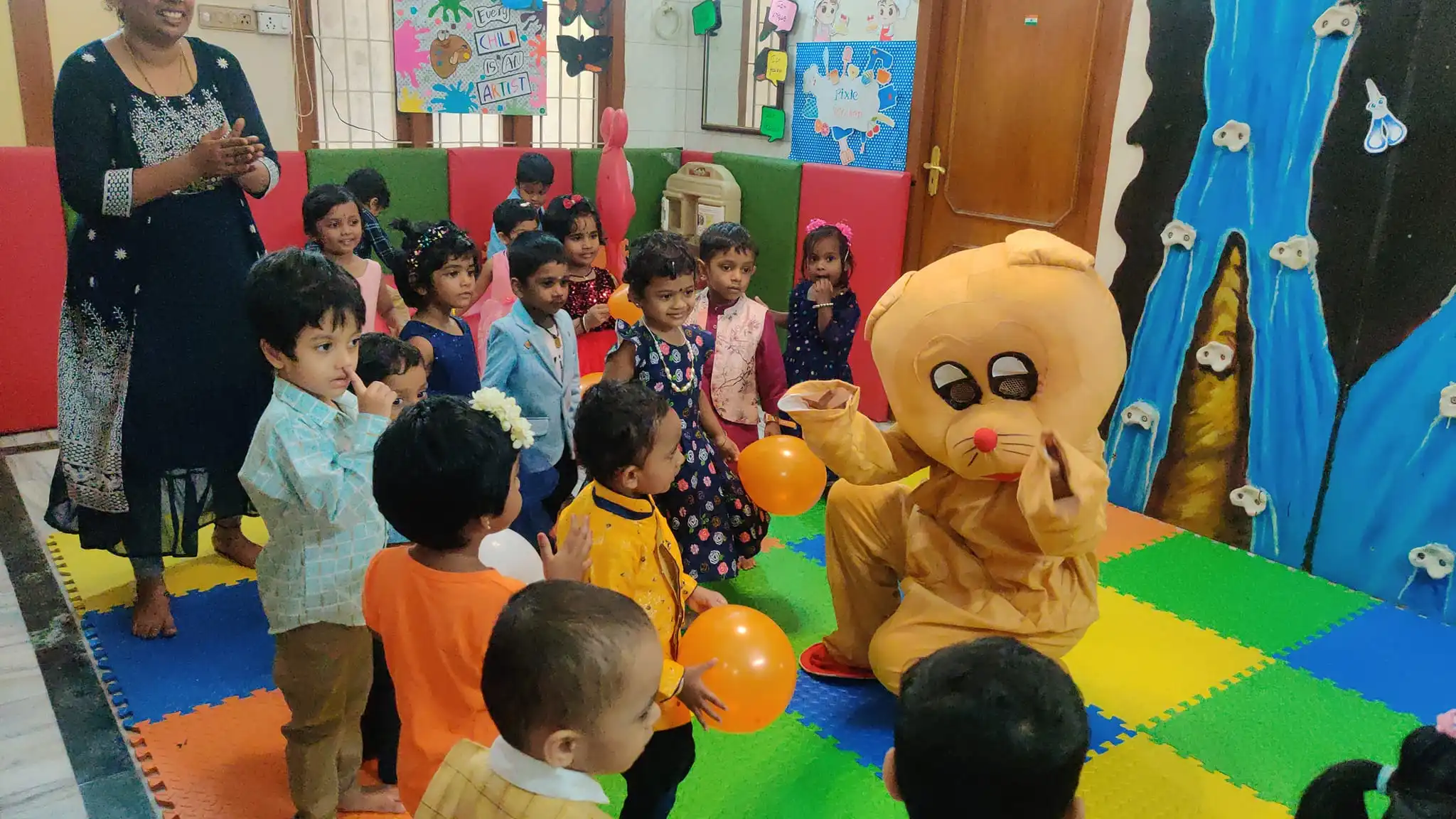 Kids with therapy dog at Pixie Play